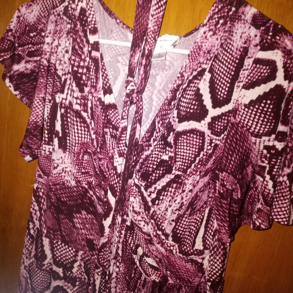 This is a pinkish purple snake skin dress made by Donna Morgan size 10